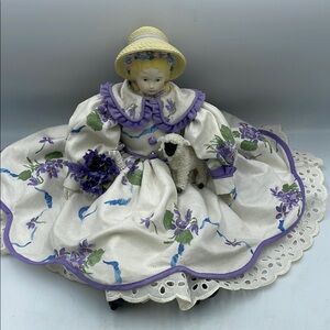 Daisy kingdom Floral Porcelain Doll with Purple Accents